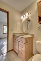 Tall sink cabinet for convenience. 