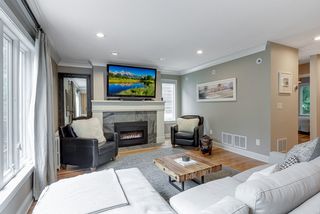 There's a lovely gas fireplace with a classic mantel and ceramic tile surround