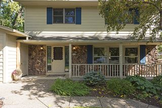Quaint front porch and perennial plantings!