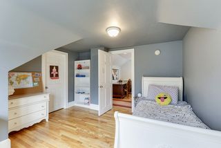 2nd bedroom on upper level with recessed drawers, walk-in closet
