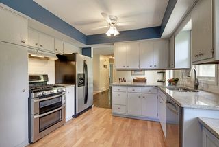 Crisp clean kitchen with a lot of counter space ready for cooking creations