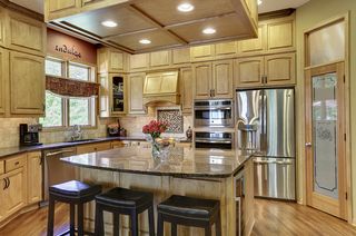 Travertine backsplash and under cabinet lighting