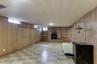 Lower level family room with wood burning fireplace...