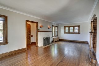 A large living room space, with wood burning fireplace, allows for 2 distinct seating areas.