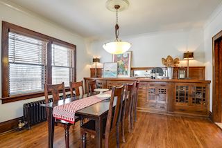 Dining Room awash in light from windows and amazing built in buffet