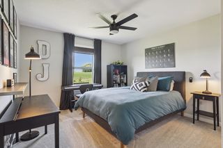 A nice-size secondary bedroom is found down the hall of the upper level.