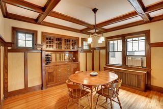 Built in buffet, with boxed beam ceiling and dramatic wainscot 