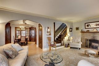 The Entertainment Sized Living Room features Hardwood Floors & Original Picture Rails...