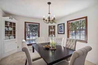 Formal dining room features oversized windows.