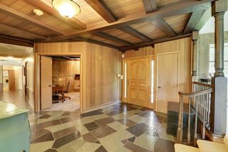 Stunning entryway is highlighted with hand cut slate tile