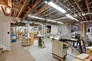 Exceptional lower level workshop with 220 electrical and newly poured concrete floor