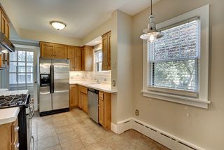 Kitchen space offers stainless steel appliances, lazy susan, cookie sheet storage, tiled floors and an efficient work triangle.
