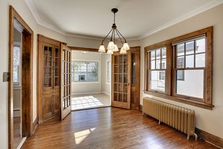 True divided-light, double doors open up to the adjoining sun porch. 