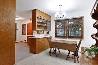 The Dining Room flows from the Kitchen and offers wooded views, storage, and plenty of seating for gatherings.
