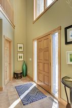 Spacious foyer with guest coat closet