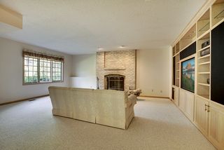A wood burning fireplace with a natural brick raised hearth.