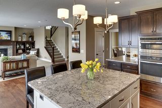Kitchen island and WI pantry across from butlers pantry
