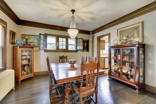 The Formal Dining Room features Original Crown Molding & Gleaming Hardwood Floors...