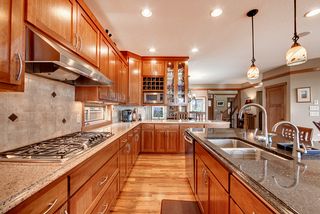 All cherry cabinetry with soft close doors and drawers. Numerous rollouts and separate tray storage builtins.