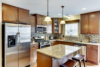 Wonderful Kitchen with Granite Countertops & Tile Backsplash