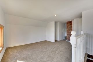 Upper Level Loft Area With Exposed Brick