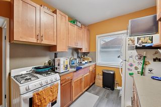View of Kitchen in Apt #2.
Features updated kitchen with Maple Cabinets, newer appliances, sink, countertops and Vinyl flooring.