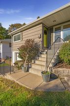 This Mid-Century Rambler features New Front Steps & Walkway! 