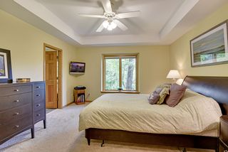 The master bedroom with spectacular backyard views offers a private full bath and large walk-in closet