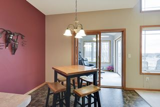 Kitchen flows into four season sun porch... 