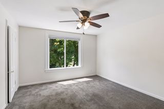 Sizable front bedroom with ceiling fan and good closet space
