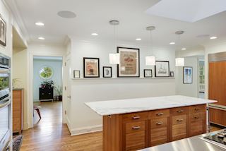 Stairs to the second floor bedrooms are off the kitchen