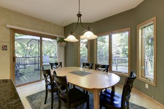 Sliding glass doors take you outside to the large deck and back yard