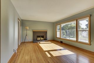 The Living Room features a Wood Burning Fireplace & Hardwood Floors...
