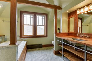 4349 Aldrich Upper level bath  has water elements and include teak and murano glass tiles, Jacussi tub and Indonesian splash bath.