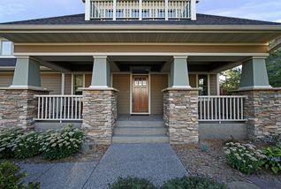 Spacious front porch with exposed aggregate walk surfaces.