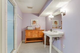 Lower level 3/4 Bath offers large steam shower and toilet room.
