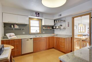WOW! The Kitchen features Bosch Appliances, Cork Floors, Granite Countertop and Stainless Steel Shelving! 