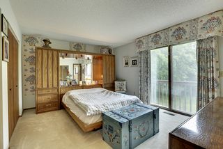 Large master bedroom with double closets and a balcony.