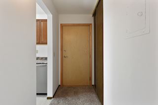 Entryway offers lots of storage into this newly painted unit