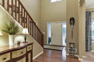 2-story entry way with side lights on the front door allowing in much natural light