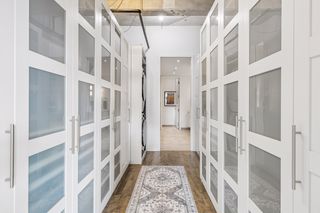 Primary walk-in closet with en-suite laundry.