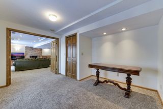 Paneled french doors out to amusement area and large closet