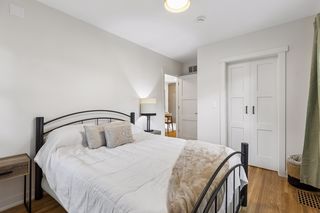 Open the dual sliding doors to a fantastic 3rd bedroom closet with custom built-ins
