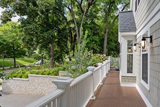 Composite decking on two sides of the home