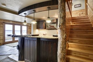 The lower level is a walkout, it is designed to entertain, the natural wood treads and stair risers invite you to this special space.