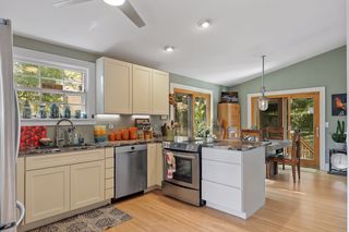 Great Kitchen with Eat In  Area and two sliding doors that lea to the  expansive outdoor deck