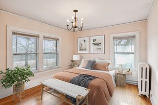 virtually staged bedroom 3 with W River Parkway views