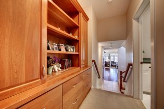 Large american cherry built-in at hall to master suite.