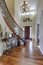 Stunning curved staircase brings architectural design to greet your guests