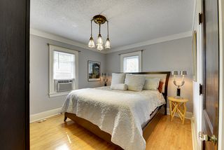 The 2nd Floor Master Bedroom features Hardwood Floors and a beautiful Light Fixture! 